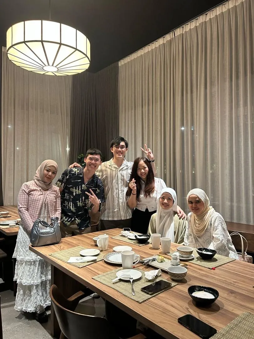 Focus Smile Dental team members around the dinner table